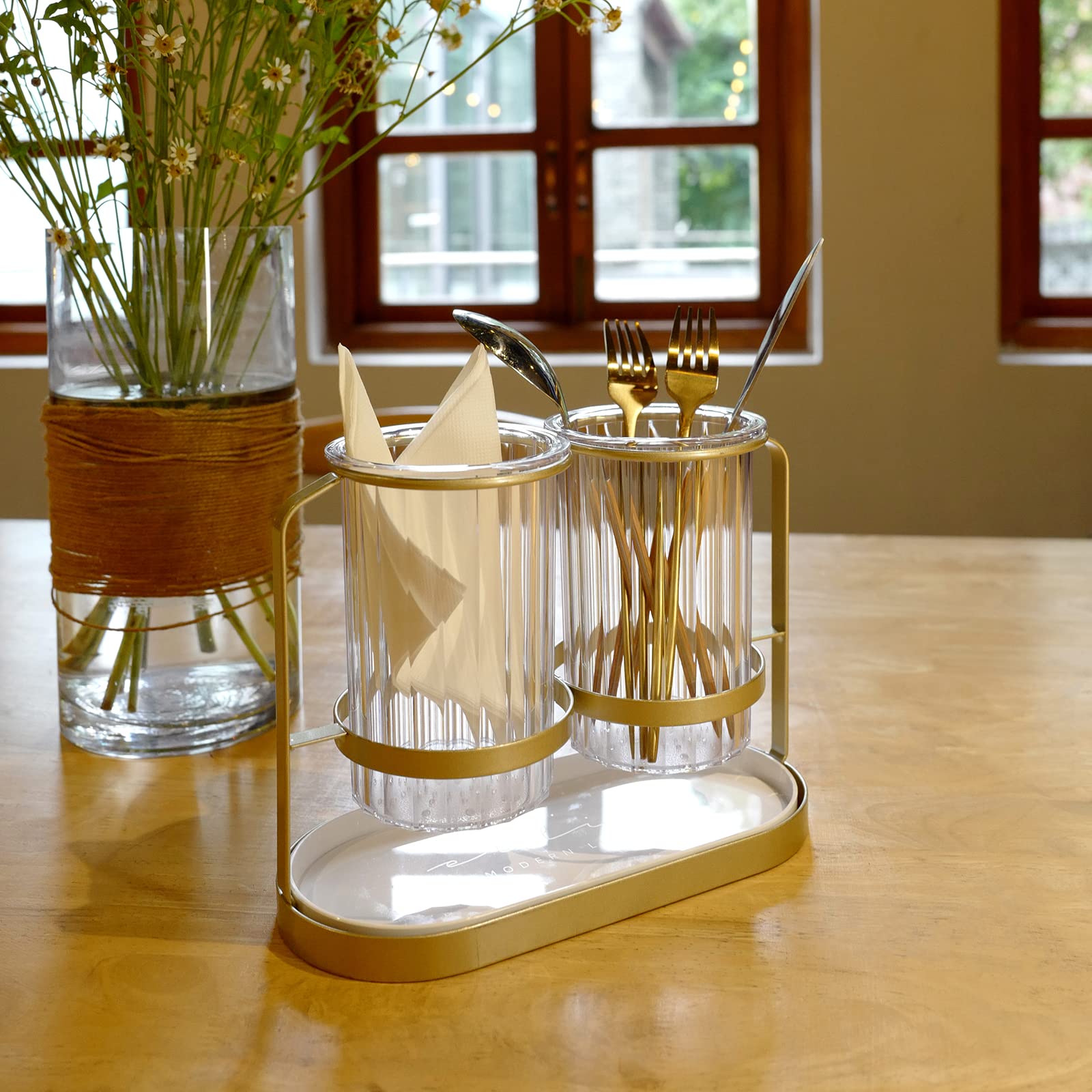 Kivsty cutlery caddy with drainage holes keeps utensils dry.