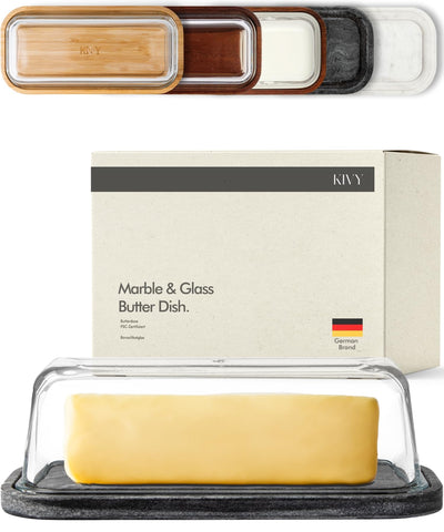 KIVY butter dish on black marble base with glass lid keeps butter clean and accessible.