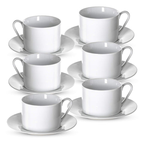 Klikel tea cups and saucers on table for elegant dining.