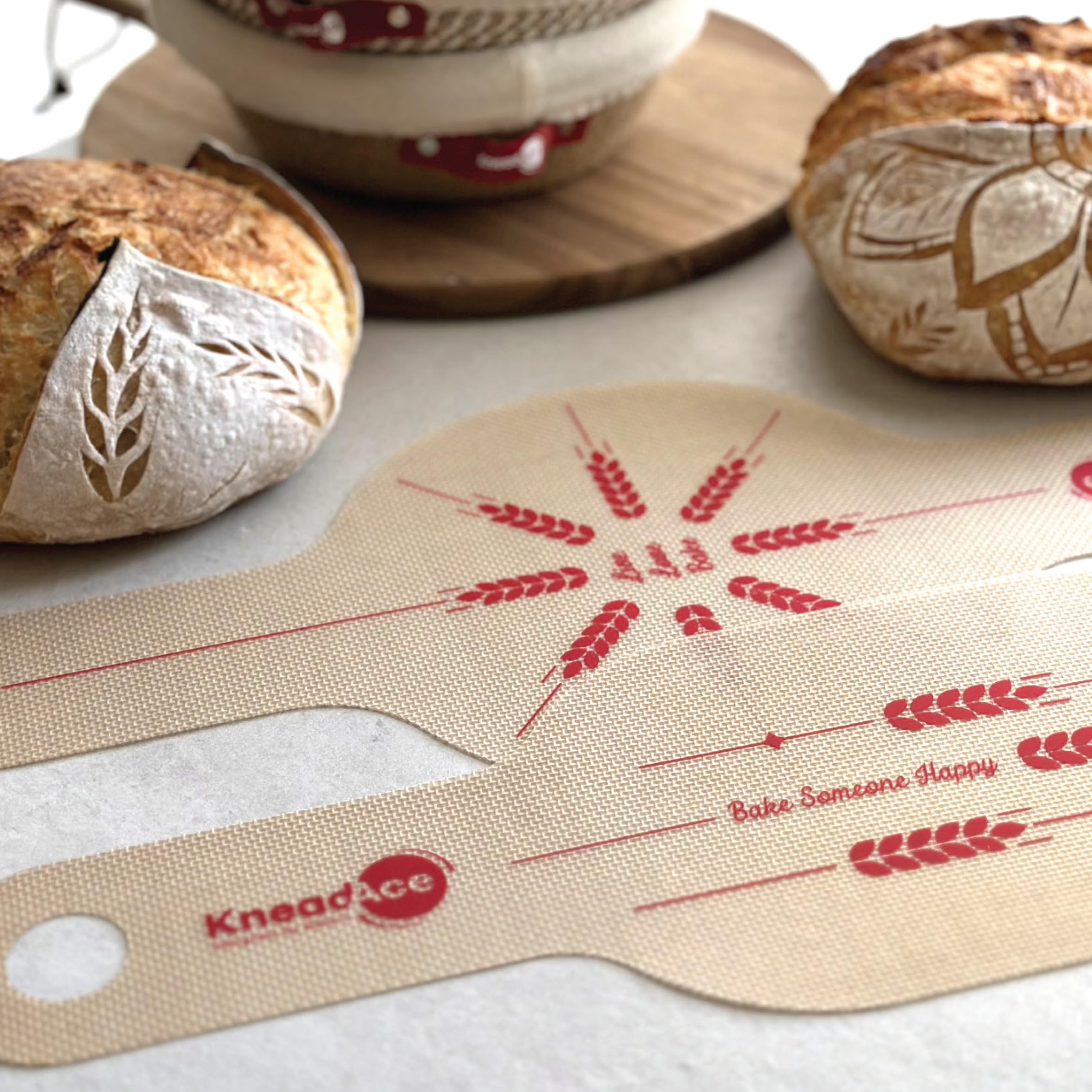 KneadAce bread sling round long handles provide stable lift for hot oven transfers.