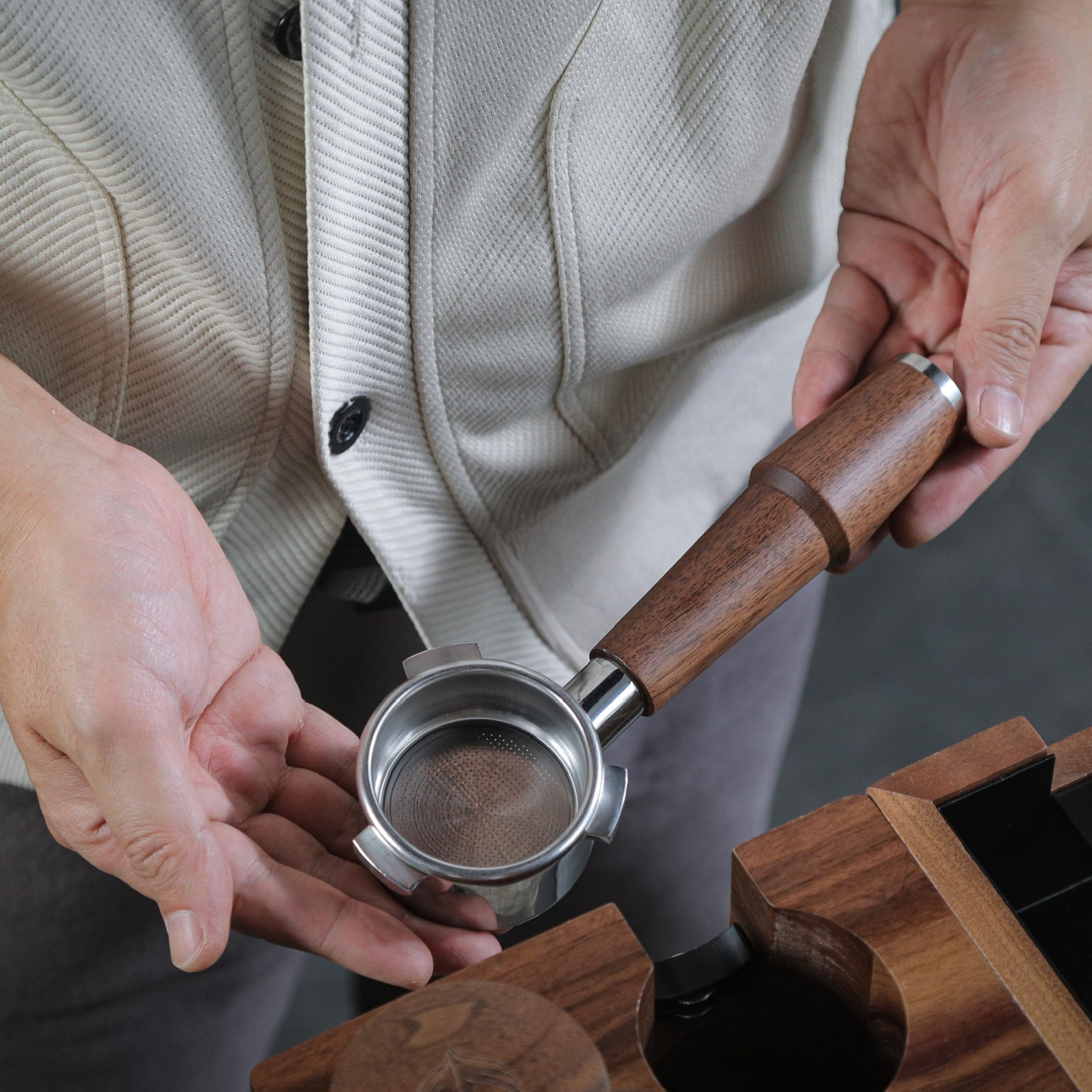 KNODOS naked 54mm portafilter showing the espresso extraction view for technique refinement