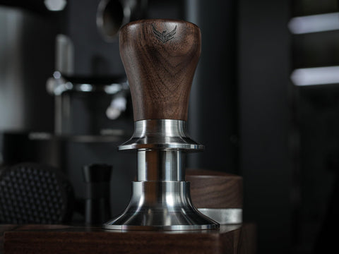 In-use scene showing steady tamp for a café-style shot.