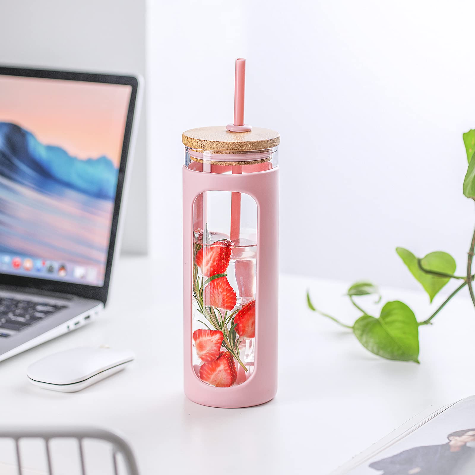Kodrine pink tumbler with silicone sleeve provides secure grip and condensation protection.