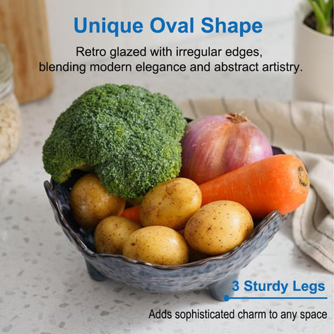 KOKUNKA pedestal blue oval bowl creates an elegant centerpiece.