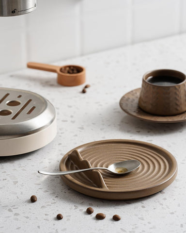 KOKUNKA brown spoon rest makes a thoughtful housewarming gift.