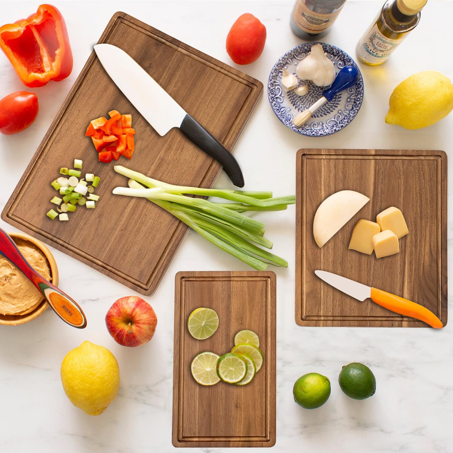 KOLWOVEN Acacia cutting board with juice canal catches liquids for easy cleanup.