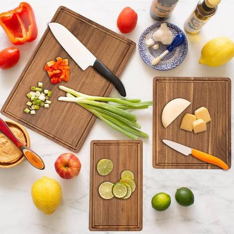 KOLWOVEN Acacia cutting board with juice canal catches liquids for easy cleanup.