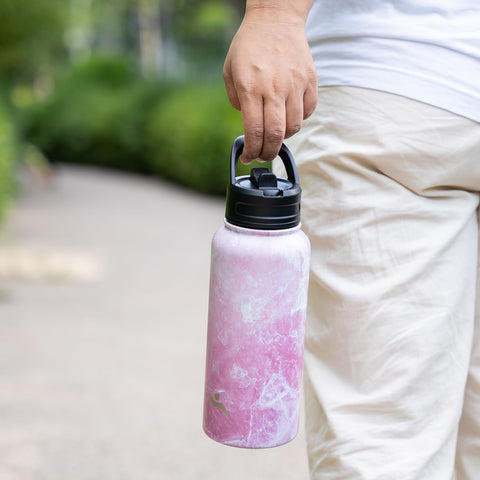 Konokyo Marble Blossom bottle in hand for gym, work, or outdoors.
