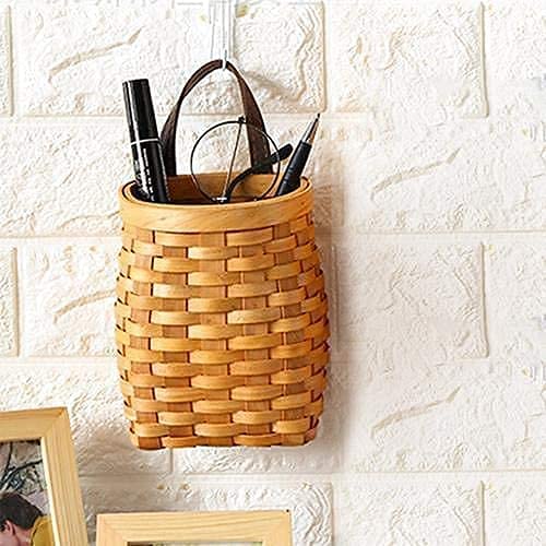 Koolouispoper handwoven wood storage basket adding natural warmth to spaces.