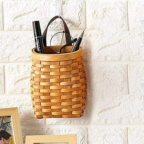 Koolouispoper handwoven wood storage basket adding natural warmth to spaces.