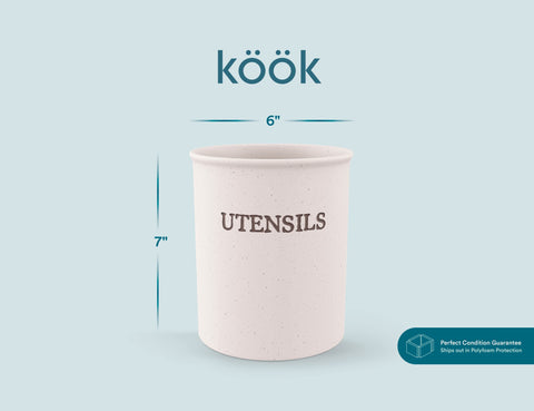 Counter scene featuring KooK utensil crock, rustic charm and practical storage.
