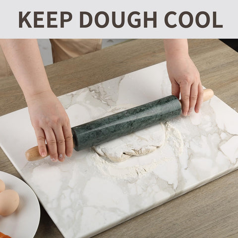 Koville rolling pin in use with dough, demonstrating comfortable grip and even pressure.