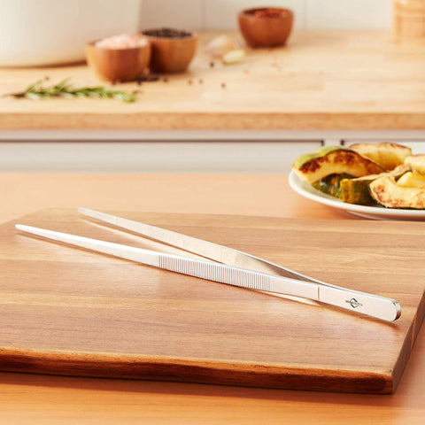 Küchenprofi long-handled tongs offer controlled performance at the stovetop.