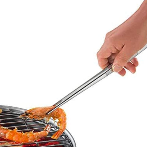 Küchenprofi tongs for plating meat with a clean, precise touch.