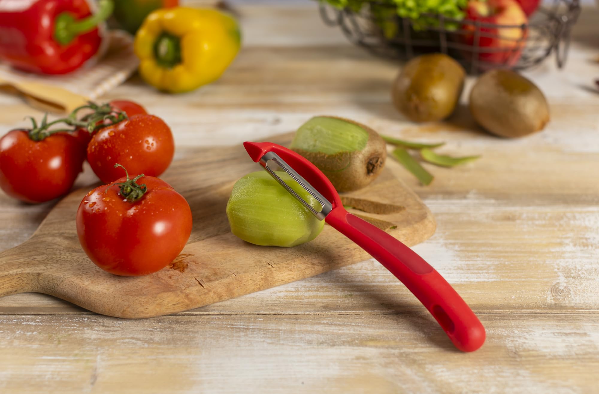 Piranha peeler hole in handle for hanging storage
