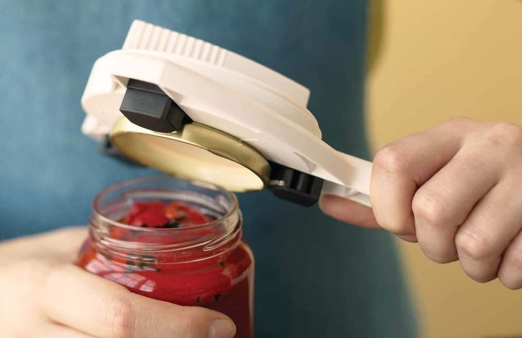 Kuhn Rikon Strain-Free Gripper Opener in use on a stubborn jar lid.