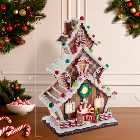 Warm glow from Kurt S. Adler LED gingerbread house enhances ambiance.
