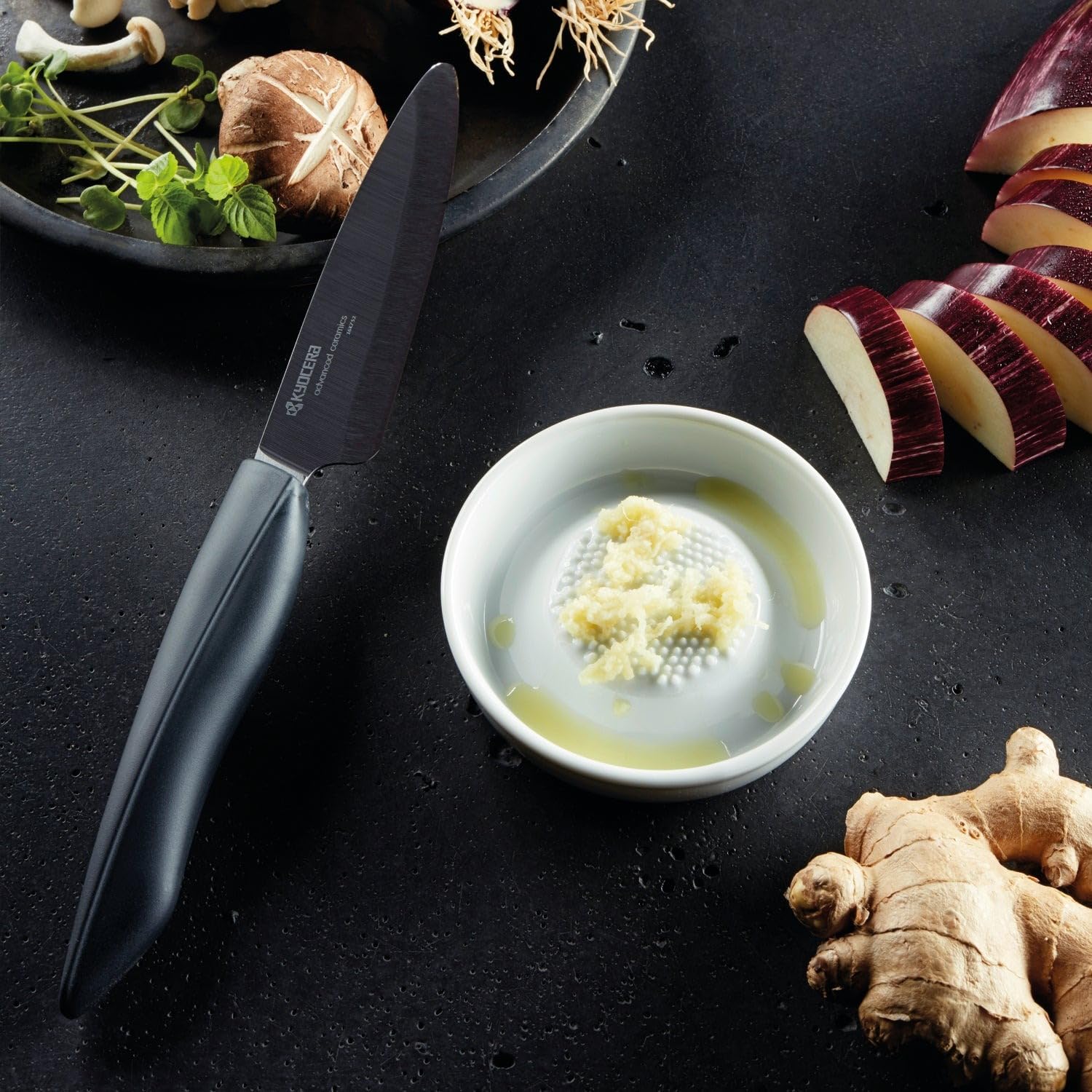 Kyocera garlic grater showing easy garlic prep for quick meals.