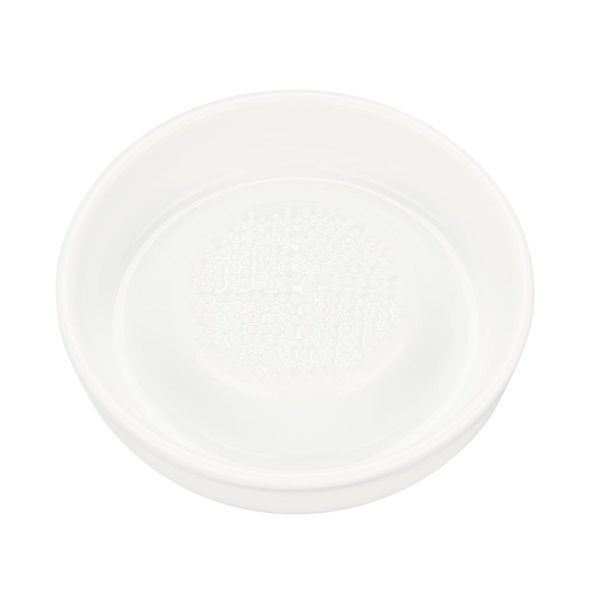 Kyocera 3.5-inch ceramic ginger grater in action for fresh flavor.