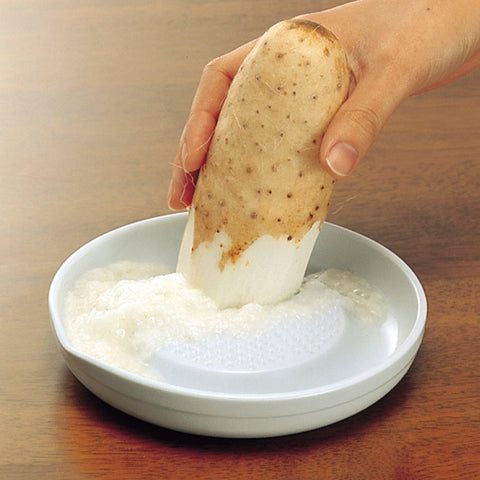 KYOCERA garlic grater with non-slip base shows stable zesting during use