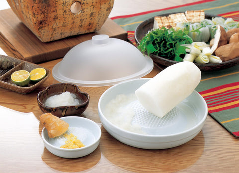 KYOCERA ceramic grater with non-corrosive bowl captures gratings and juices