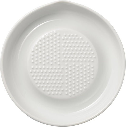 KYOCERA ceramic grater with conical blades for fast, even grating.