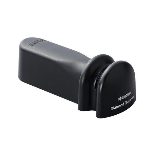 KYOCERA sharpener in use sharpening a ceramic knife for daily kitchen prep