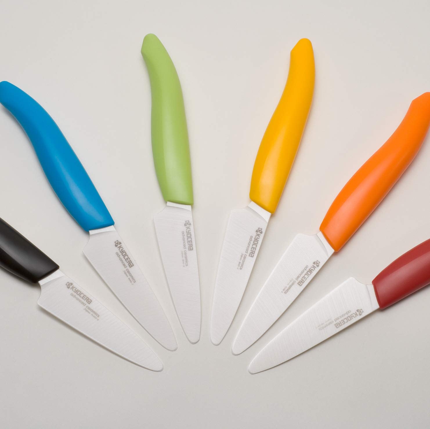 Kyocera Revolution 3-inch paring knife showing ergonomic handle design for controlled trimming.