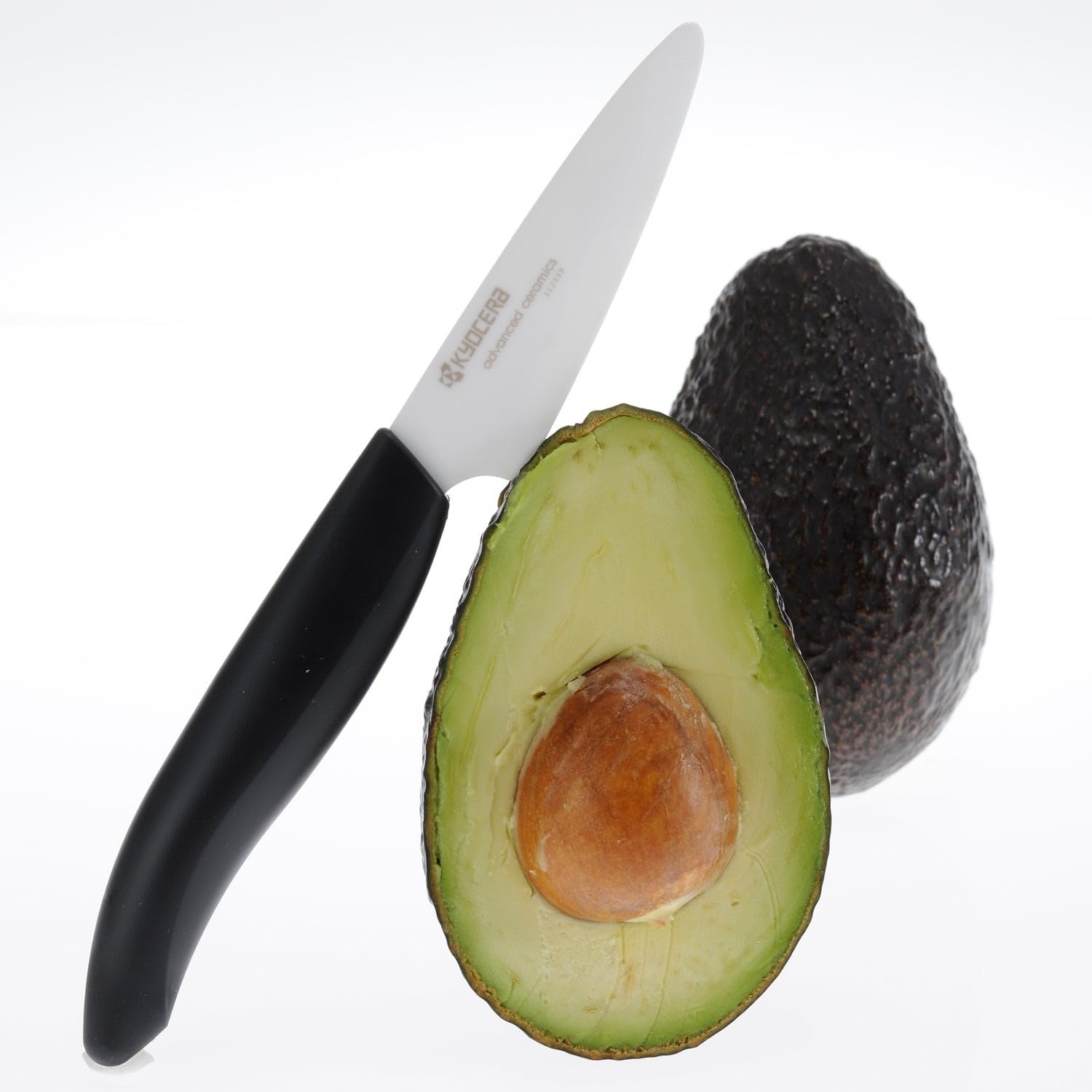 KYOCERA Revolution paring knife close-up showing razor-sharp zirconia blade