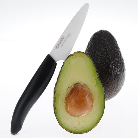 KYOCERA Revolution paring knife close-up showing razor-sharp zirconia blade