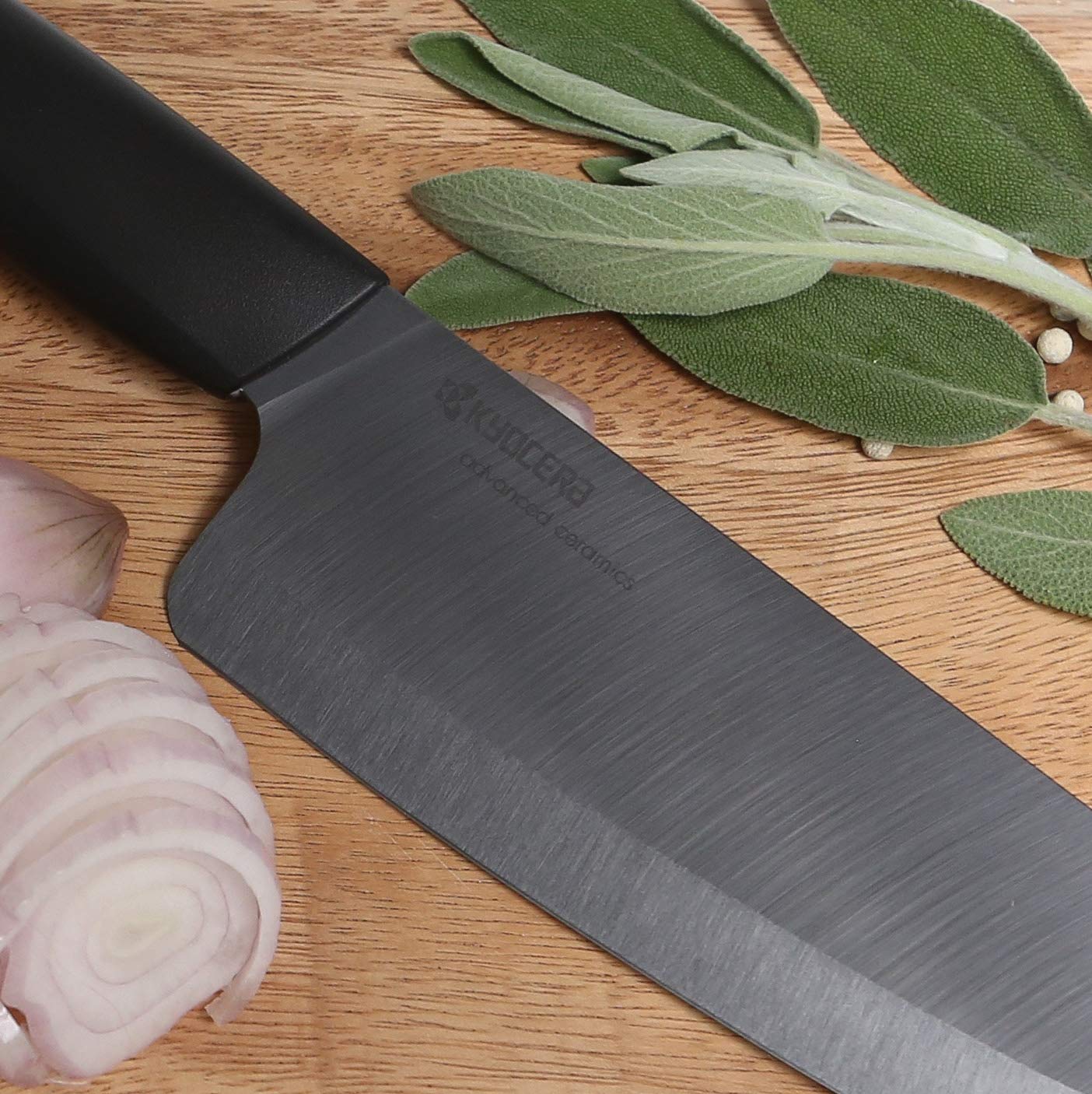 Close-up of the ceramic blade on the Kyocera Revolution Santoku showing sharp edge