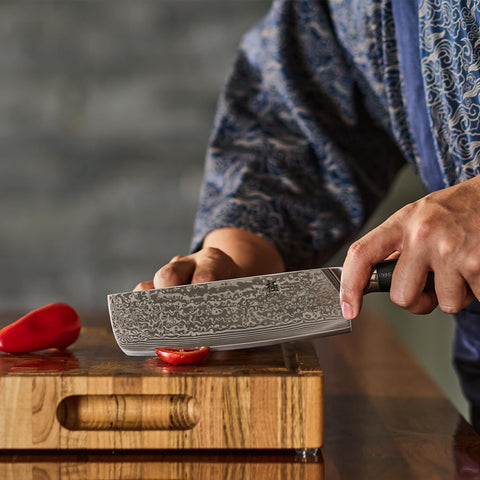 KYOKU blade in wooden storage box highlights craftsmanship and premium storage.