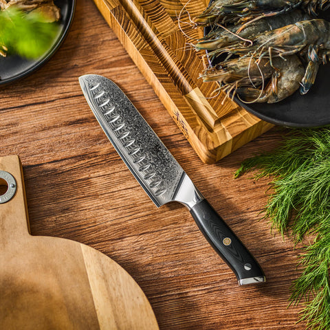KYOKU Santoku Knife close-up edge showing precision grind and finish.