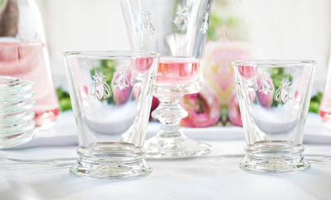 Bee emblem detail on La Rochere tumbler highlighting heritage design.