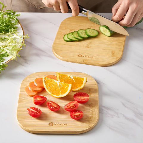 Laboos bamboo board provides safe prep surface for baby's snacks.