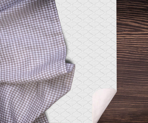 LAMINET table pad on dining table offers spill resistance during meals.
