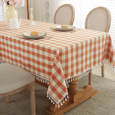 Laolitou checkered fall tablecloth in orange and white adds cozy farmhouse charm.