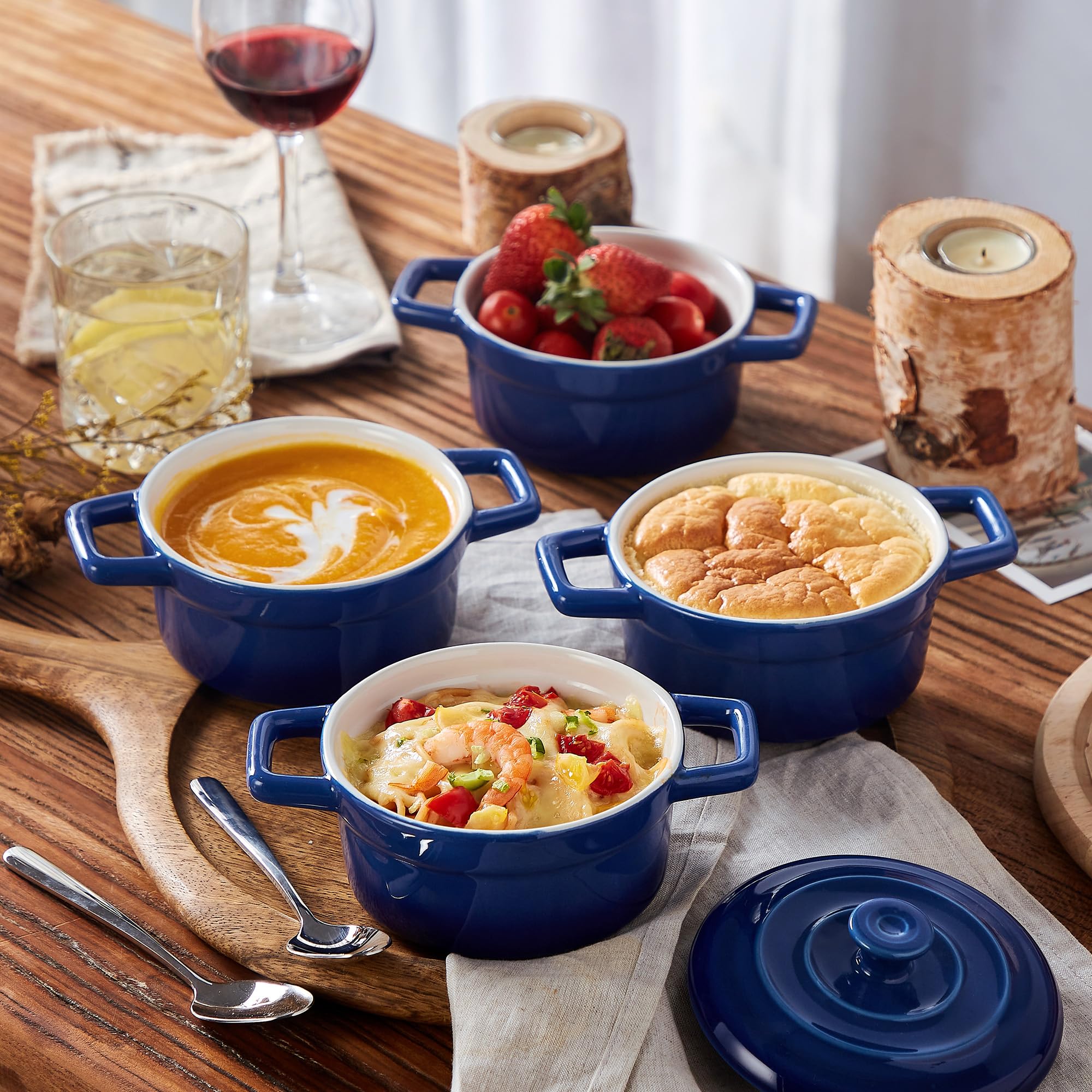 Lareina blue cocotte with handles for easy serving and heat retention.