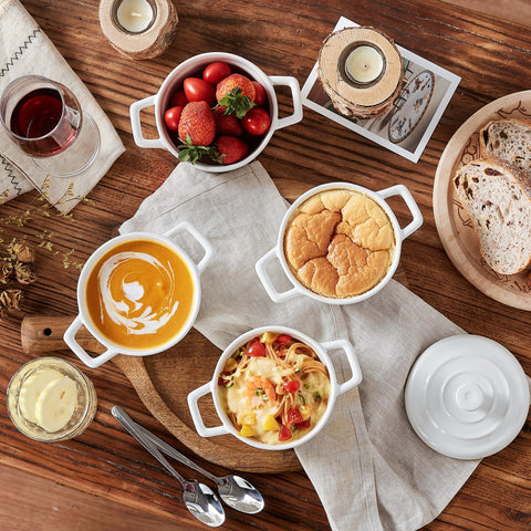 Lareina Mini Cocotte 12oz white holds stew or chili while elegant on table.