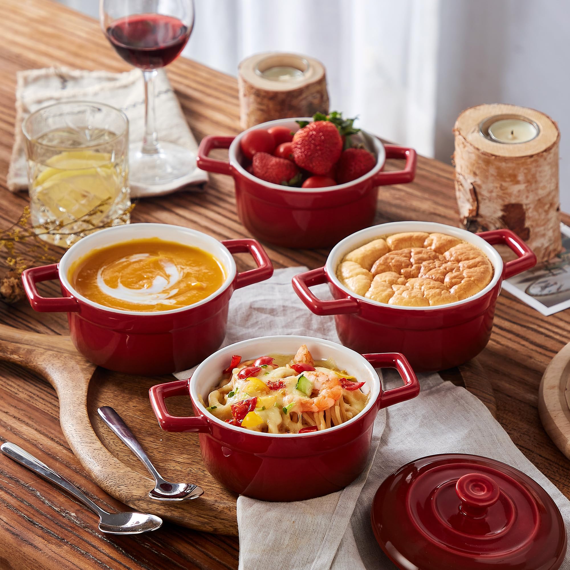 Lareina red cocotte with ergonomic handles for easy transport.