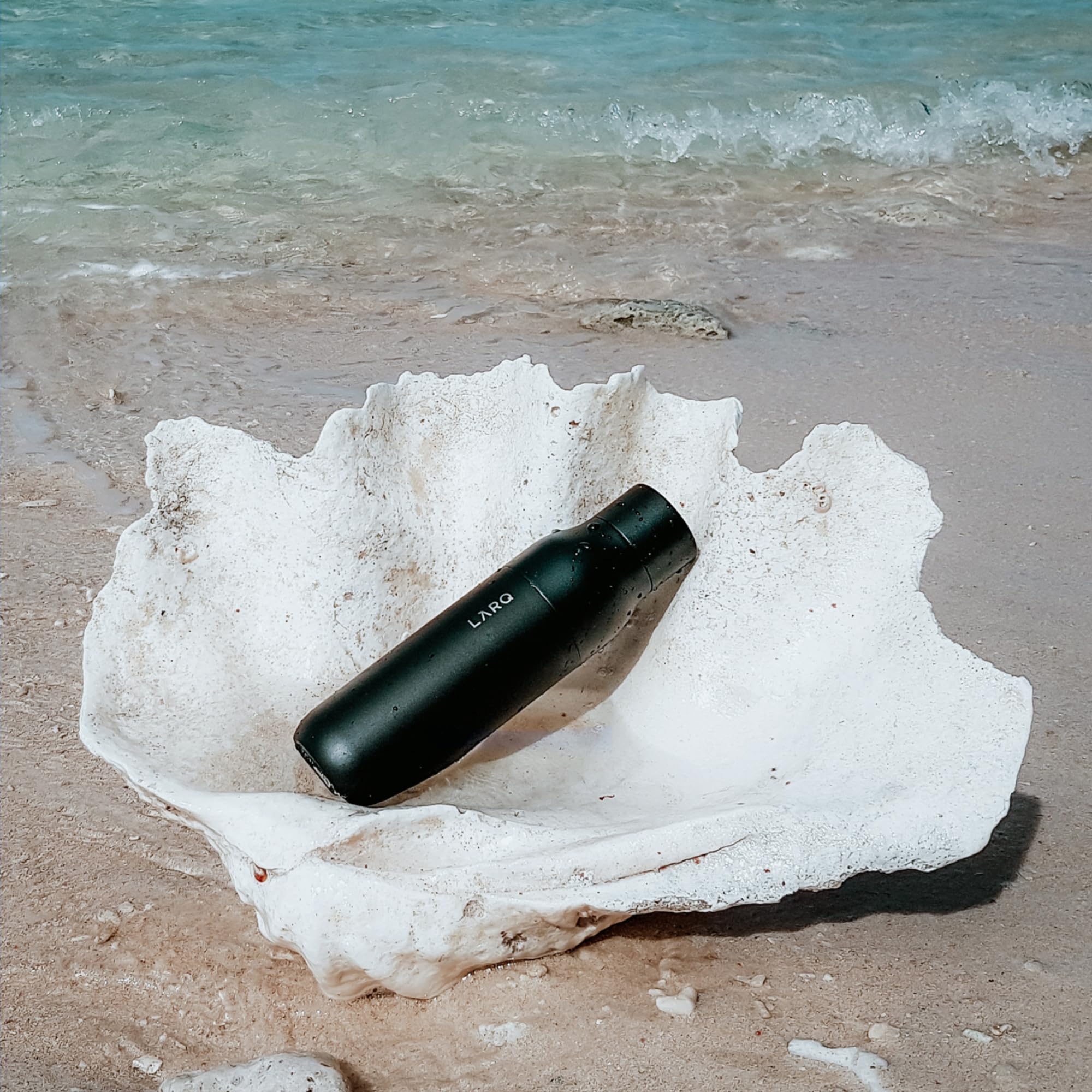 LARQ PureVis pouring action shot shows smooth, spill-free drinking experience.