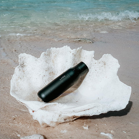 LARQ PureVis pouring action shot shows smooth, spill-free drinking experience.