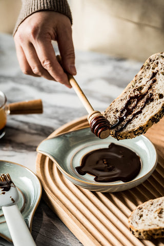 LAUCHUH spoon rest on counter with multiple utensils