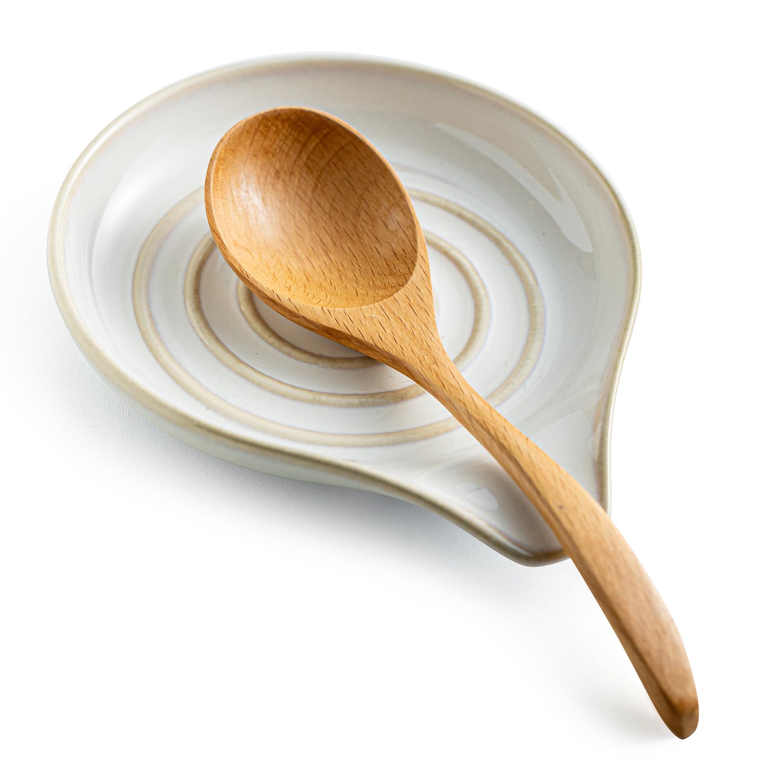 LAUCHUH spoon rest on stove top in cream finish keeps utensils tidy.