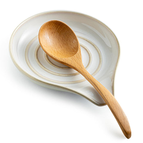 LAUCHUH spoon rest on stove top in cream finish keeps utensils tidy.