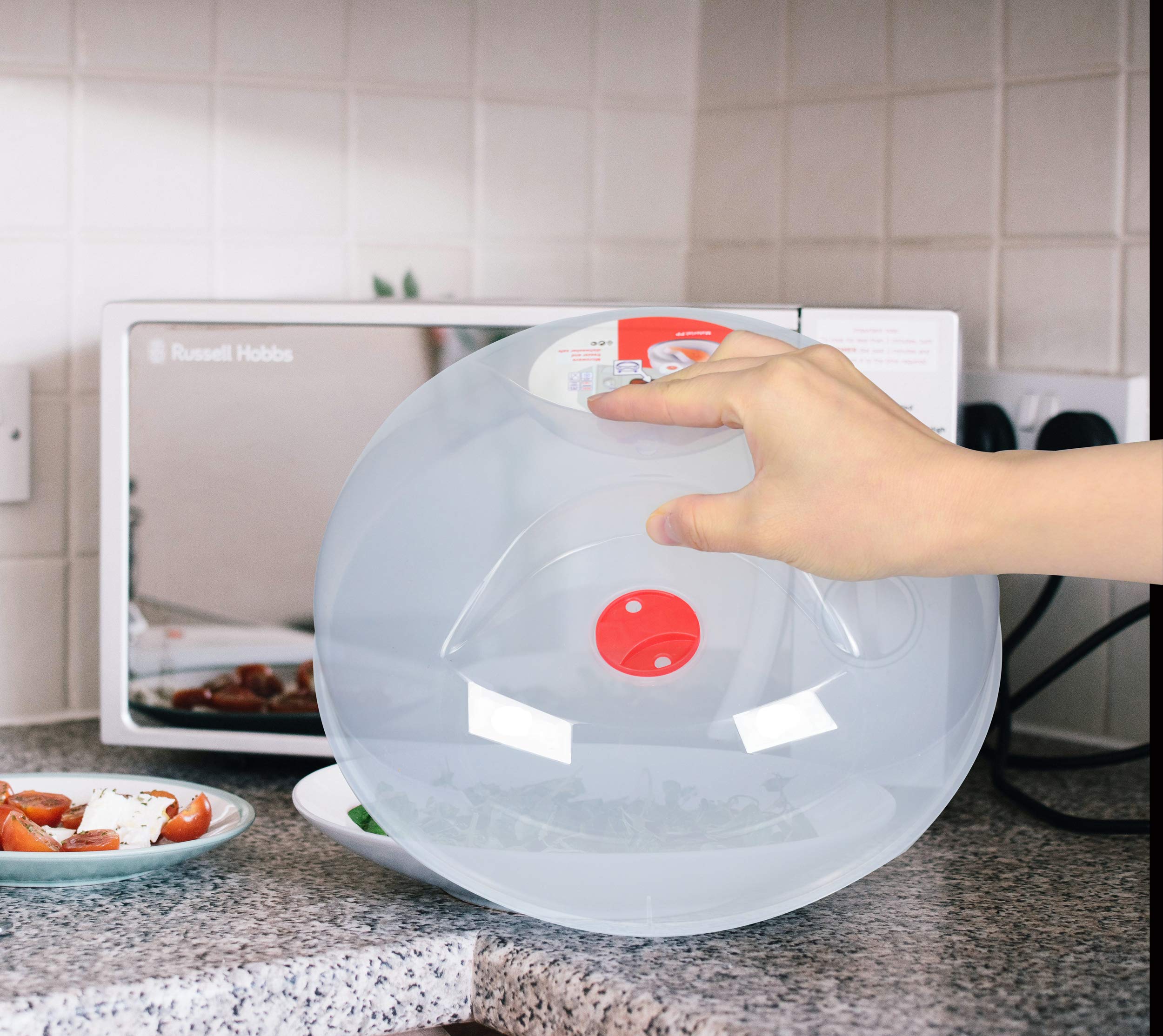 Layron microwave splatter cover showing perforated steam vents for moisture release