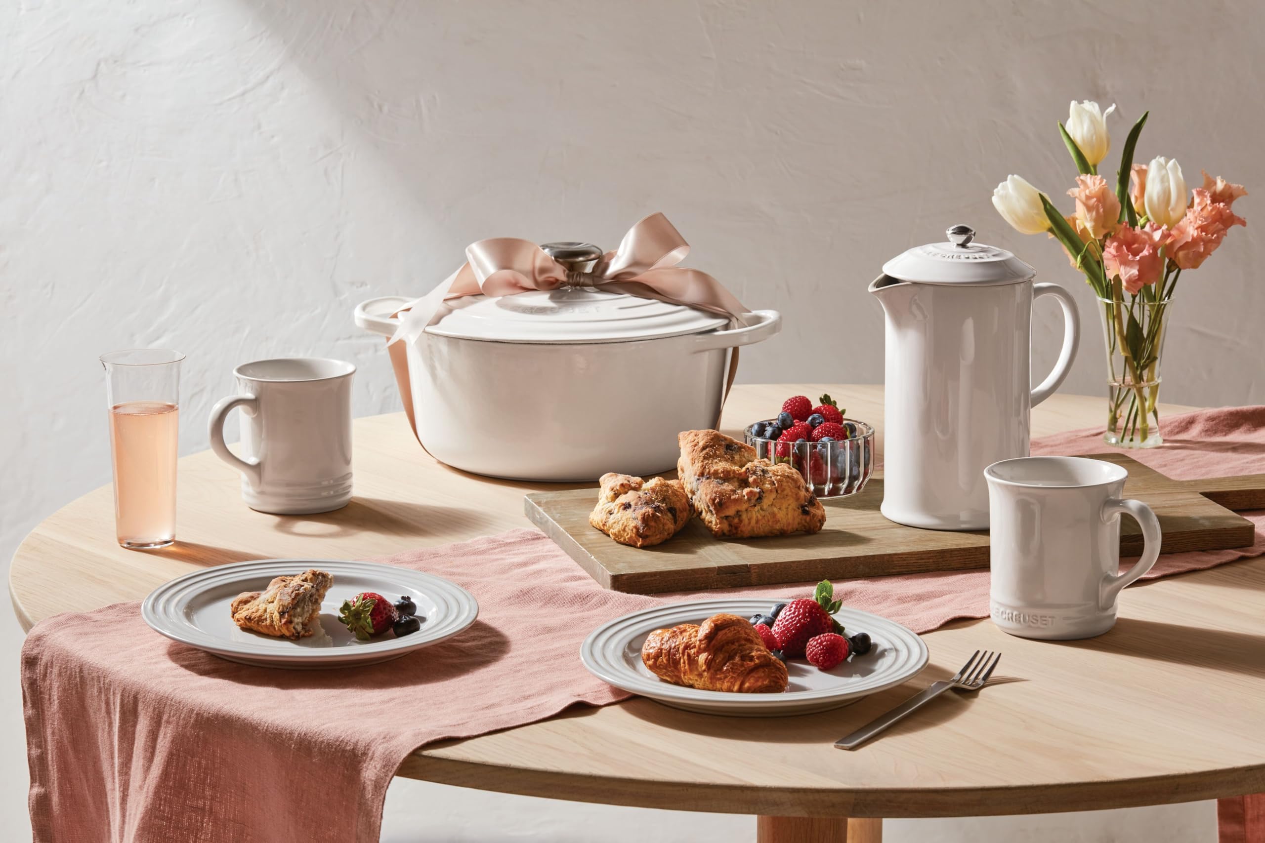 Le Creuset 14 oz white dishwasher-safe mug ready for cleaning