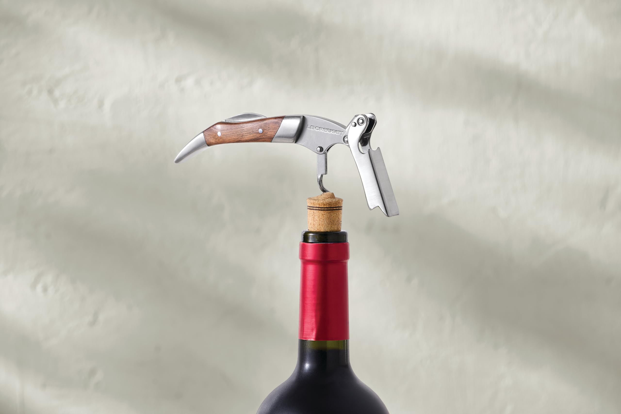 Le Creuset black walnut handle provides secure ergonomic grip