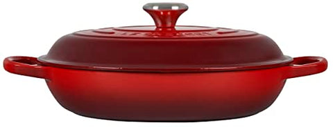 Le Creuset braiser cerise lid circulates steam to lock moisture.