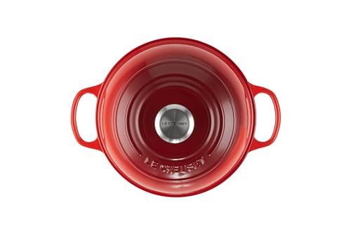 Le Creuset Bread Oven Cerise domed lid traps steam to improve loaf rise.